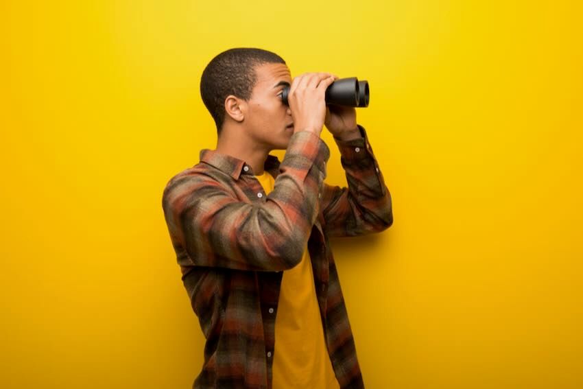Male using binoculars