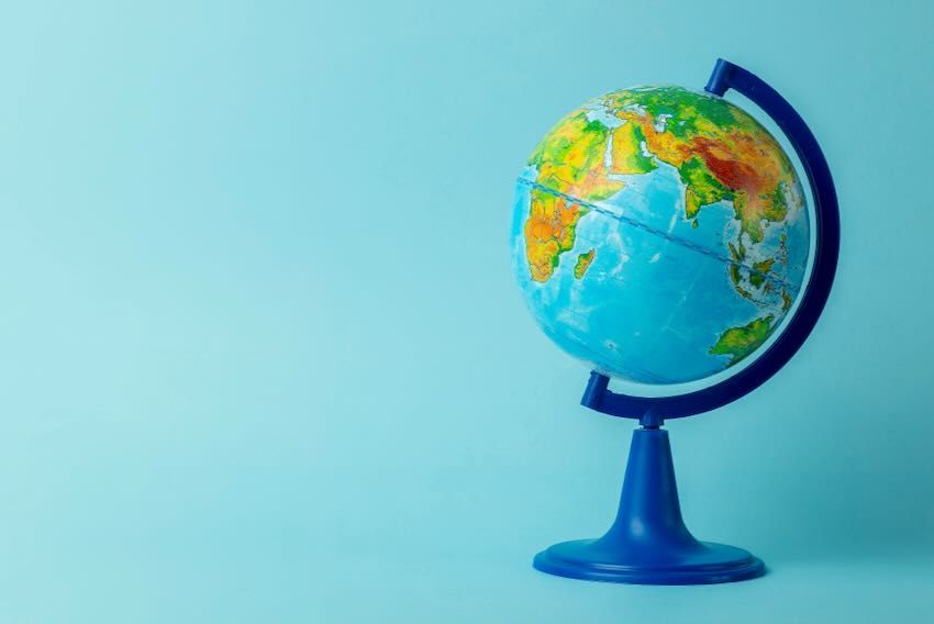 Globe on blue background AdobeStock